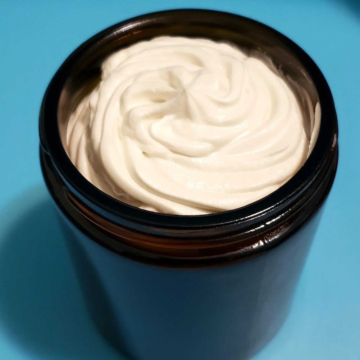 Butter-Kissed Shea Face & Body Moisturizer is formulated with a blend of oils and sea moss, boasting high levels of vitamins and delivering long-term hydration to dry, rough, and cracked skin. Its soft texture and antibacterial elements provide a nourishing experience while reducing skin irritations and blemishes. This moisturizer improves skin texture and provides anti-inflammatory properties to help keep skin smooth and itch-free.